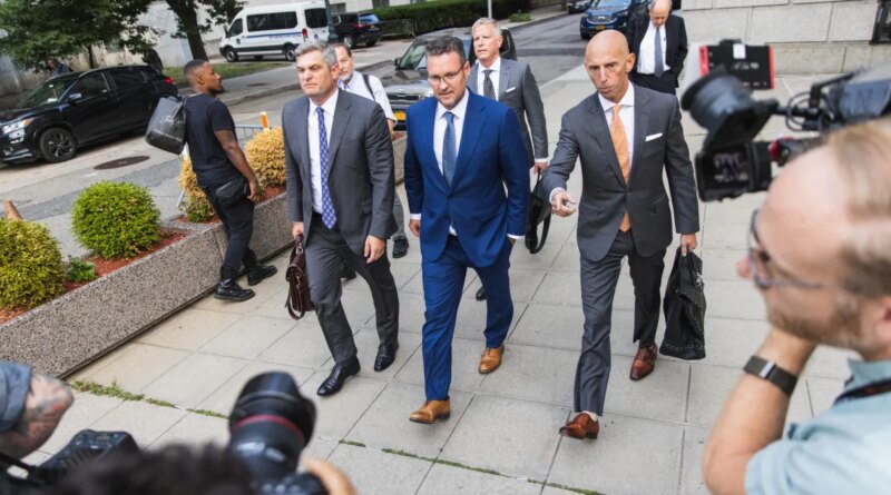 Trevor Milton, founder of Nikola Corp., center, exits court in New York, US