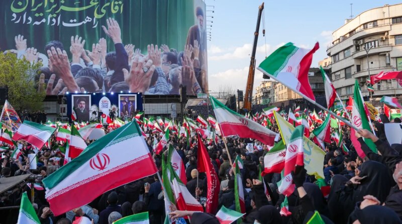 Demonstrators wave Iranian national flags as they gather for a rally in support of the new Supreme Leader at Enghelab Square in central Tehran on March 9, 2026. Iran marked the appointment of Ayatollah Mojtaba Khamenei to replace his father as Supreme Leader after Ayatollah Ali Khamenei was killed in joint U.S. and Israeli strikes on February 28.