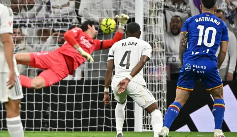 Getafe's Uruguayan forward #10 Martín Satriano scores the opening goal during the Spanish league football match between Real Madrid CF and Getafe CF at Santiago Bernabeu Stadium in Madrid on March 2, 2026. (Photo by Javier SORIANO / AFP)