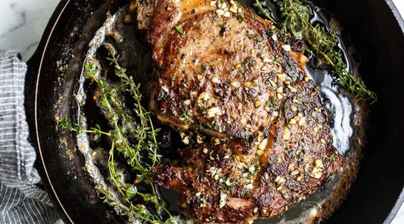 Sizzling Cast Iron Steak with Herbed Butter