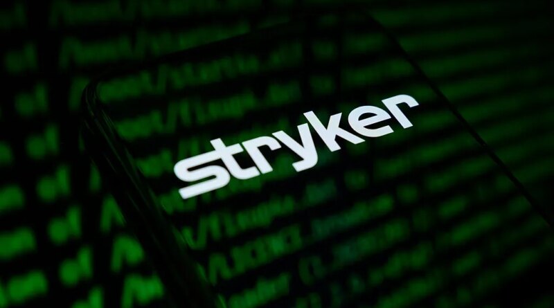 The Stryker Corporation logo appears on the screen of a smartphone