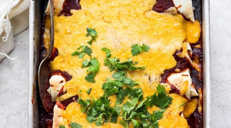 pan of enchiladas with cheese on top