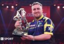 Luke Littler holds the UK Open trophy