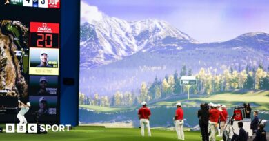 A man hitting a shot on an indoor golf simulator