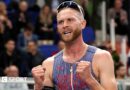 Josh Kerr celebrates winning world indoor 3,000m gold
