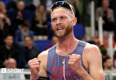 Josh Kerr celebrates winning world indoor 3,000m gold
