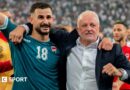 Aymen Hussein (L) raises his fist as he celebrates alongside Iraq head coach Graham Arnold (R) in Basra, Iraq, o