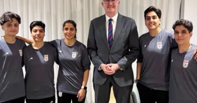 An undated and unplaced photo released by Australia's Department of Home Affairs shows Home Affairs minister Tony Burke (3/R) with five Iranian women football players who applied for asylum after competing in the Women's Asia Cup tournament being played in Australia. Australia has granted asylum to some of Iran's visiting women's football team over fears they faced persecution at home for not singing the national anthem before a match, Home Affairs Minister Tony Burke said on Tuesday. (Photo by HANDOUT / AUSTRALIAN DEPARTMENT OF HOME AFFAIRS / AFP) / ----EDITORS NOTE ----RESTRICTED TO EDITORIAL USE MANDATORY CREDIT " AFP PHOTO / DEPARTMENT OF HOME AFFAIRS" NO MARKETING NO ADVERTISING CAMPAIGNS - DISTRIBUTED AS A SERVICE TO CLIENTS