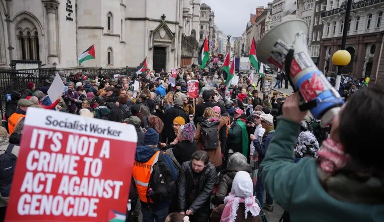 Supporters of Palestine Action stage a protest outside the Royal Court of Justice in London