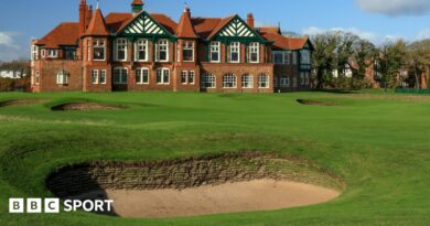 A view of a bunker in front of the 18th green at Royal Lytham & St Annes, with the clubhouse in the background