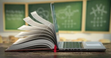 open laptop conjoined to open book