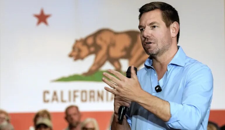 California gubernatorial candidate, Rep. Eric Swalwell, D-CA, appears at a town hall meeting in Sacramento, Calif., Tuesday, April 7, 2026. (AP Photo/Rich Pedroncelli)
