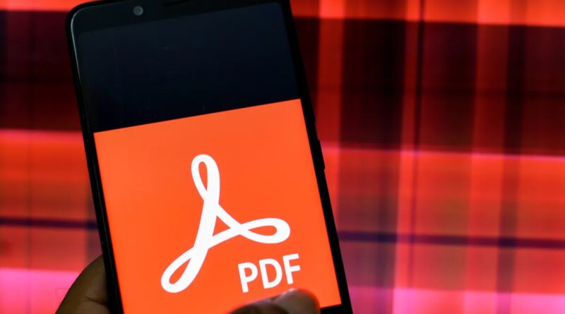 In this Photo illustration an Adobe PDF logo seen displayed on a Smartphone.