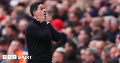 Declan Rice with his hands on his head.
