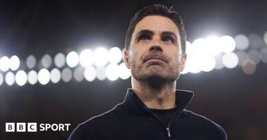 Mikel Arteta with lights behind him