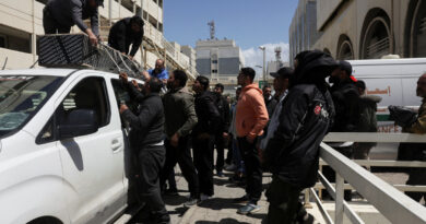 At Beirut hospital, grieving families identify mangled bodies after Israeli strikes