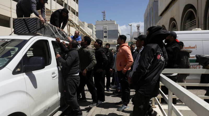 At Beirut hospital, grieving families identify mangled bodies after Israeli strikes