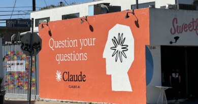 Claude ad on side of building