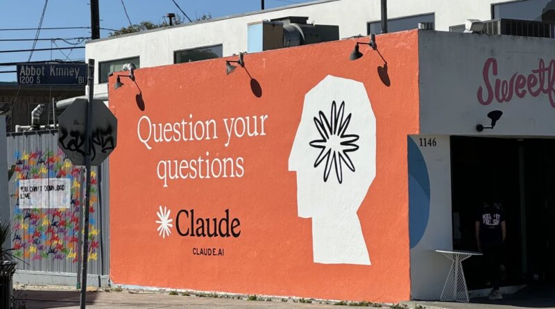 Claude ad on side of building