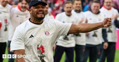 Bayern Munich players line up to celebrate winning the Bundesliga title