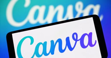 In this photo illustration, the Canva logo is seen on a smartphone and in the background.