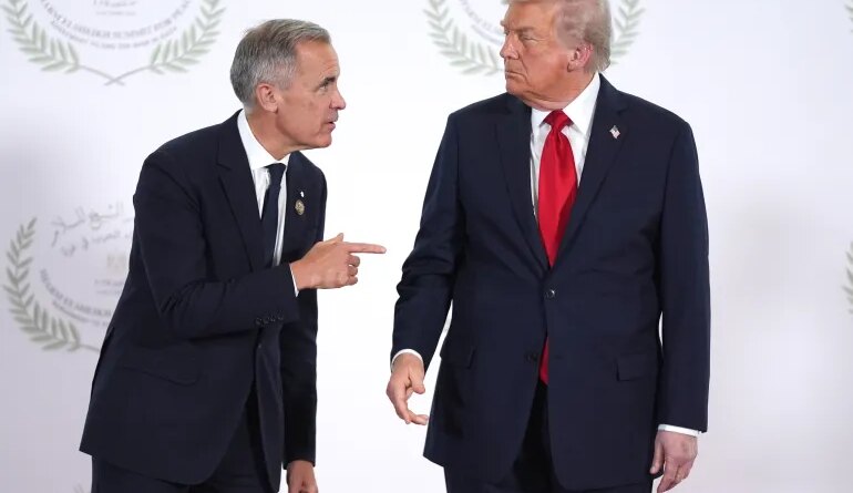 SHARM EL-SHEIKH, EGYPT - OCTOBER 13: President Donald Trump greets Canada's Prime Minister Mark Carney during a world leaders' summit on ending the Gaza war on October 13, 2025 in Sharm El-Sheikh, Egypt. President Trump is in Egypt to meet with European and Middle Eastern leaders in what’s being billed as an international peace summit, following the start of a US-brokered ceasefire deal to end the war in the Gaza Strip. (Photo by Evan Vucci - Pool / Getty Images)
