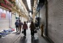 People walk past closed shops at the Grand Bazaar in Tehran, Iran on March 30, 2026.