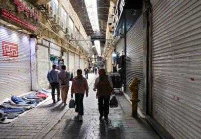 People walk past closed shops at the Grand Bazaar in Tehran, Iran on March 30, 2026.