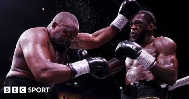 Derek Chisora is punched by Deontay Wilder