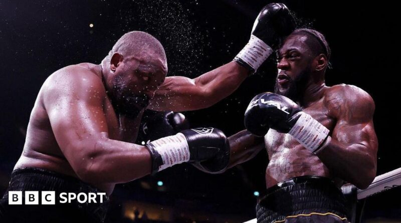 Derek Chisora is punched by Deontay Wilder