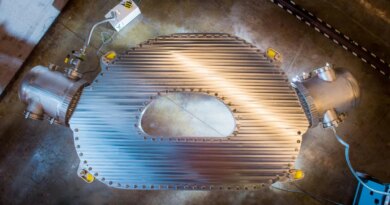 A large HTS magnet sits on the floor of a warehouse.