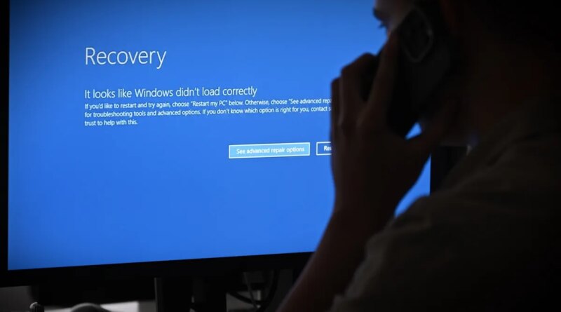 In this photo illustration the blue screen of death errors on computer screens are viewed due to a global communications outage.