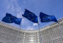 Flags of Europe as seen waving from the flagpoles in front of the EU Commission headquarters.