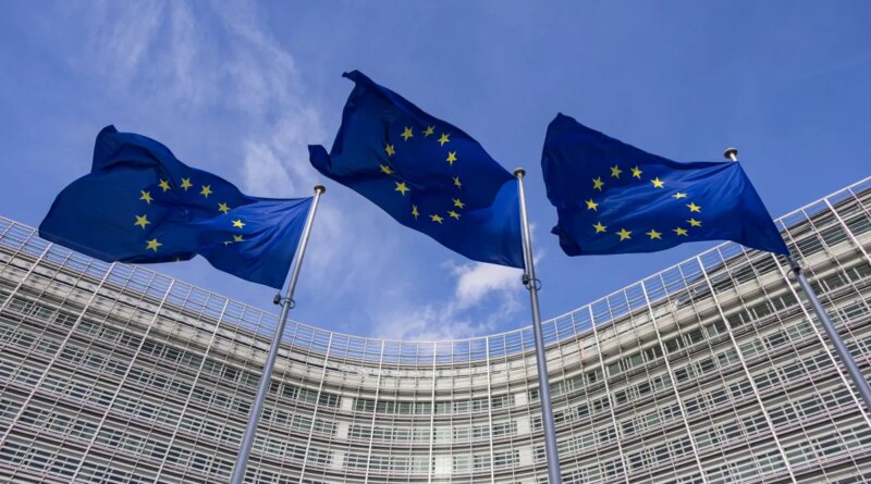 Flags of Europe as seen waving from the flagpoles in front of the EU Commission headquarters.