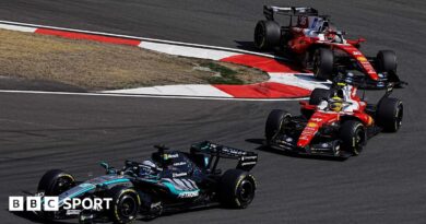 Mercedes' George Russell comes out of a hairpin ahead of Ferrari's Lewis Hamilton with Charles Leclerc immediately behind during the Chinese Grand Prix sprint race