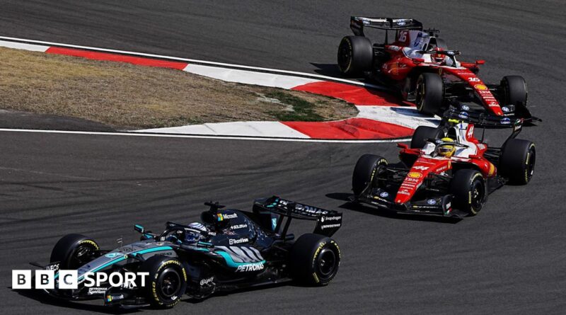 Mercedes' George Russell comes out of a hairpin ahead of Ferrari's Lewis Hamilton with Charles Leclerc immediately behind during the Chinese Grand Prix sprint race