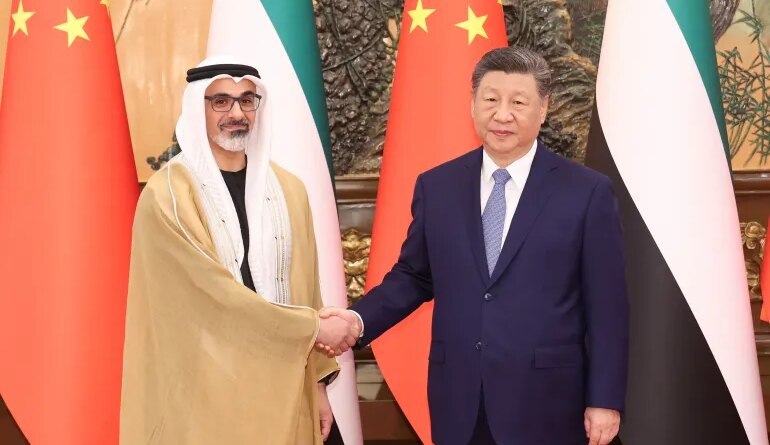 China's President Xi Jinping shakes hands with Sheikh Khaled bin Mohamed bin Zayed Al Nahyan, Crown Prince of Abu Dhabi, United Arab Emirates, in Beijing, China, April 14, 2026. cnsphoto via REUTERS ATTENTION EDITORS - THIS IMAGE WAS PROVIDED BY A THIRD PARTY. CHINA OUT. NO COMMERCIAL OR EDITORIAL SALES IN CHINA