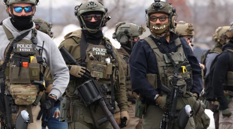 US Homeland Security Investigations (HSI) agents stand guard at the Bishop Henry Whipple Federal Building in Minneapolis, Minnesota, on January 8, 2026.