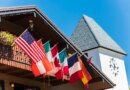 Clock Tower and Chalet Building with Flags in Vail, Colorado