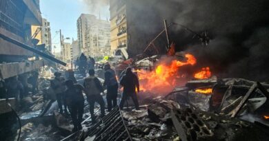 In the heart of Beirut, buildings in flames and charred cars