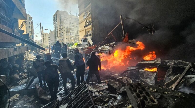 In the heart of Beirut, buildings in flames and charred cars
