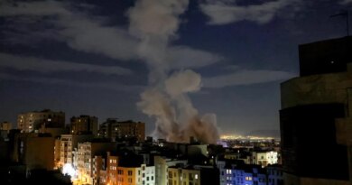 A smoke plume rises following a missile strike on a building in Tehran on March 1, 2026.