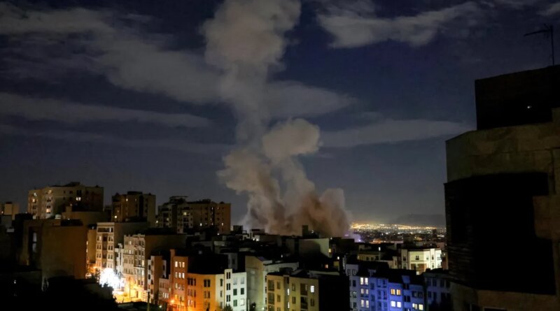 A smoke plume rises following a missile strike on a building in Tehran on March 1, 2026.