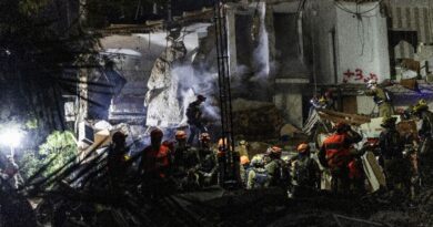 Israeli rescuers search for missing in building strike, two dead