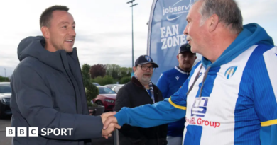 John Terry shakes hands with a Colchester fan