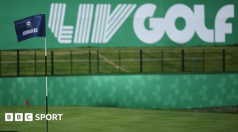 A flag on a golf course green in front of a sign that says 'LIV Golf'
