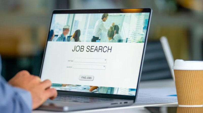 Close up of a Businessman looking at a job search recruitment web page.