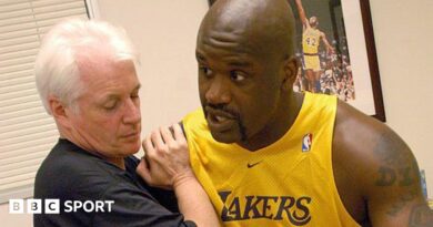 Alex McKechnie doing some physio with Shaquille O'Neal