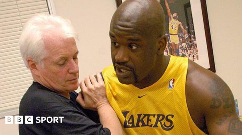 Alex McKechnie doing some physio with Shaquille O'Neal