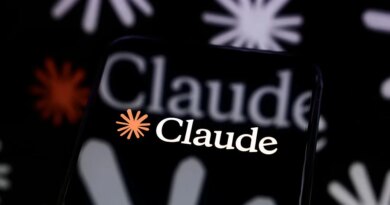 The Claude logo is displayed on a smartphone screen placed on a reflective surface onto which a multitude of Claude logos are projected.